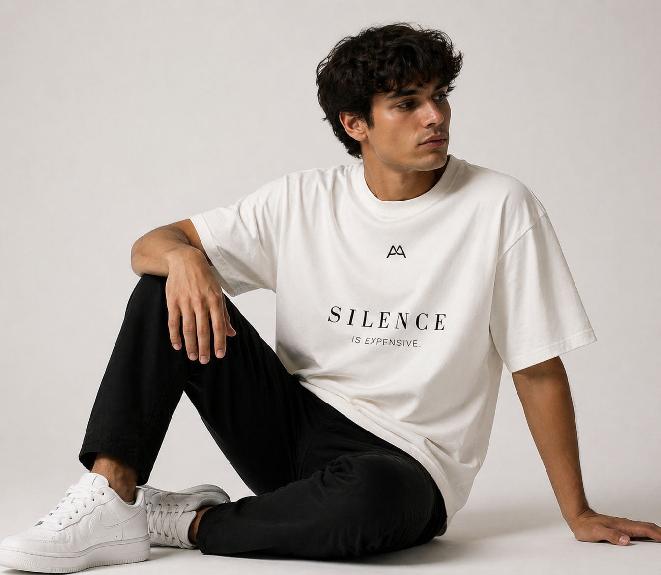 Model wearing the Silence Is Expensive heavyweight tee in natural raw